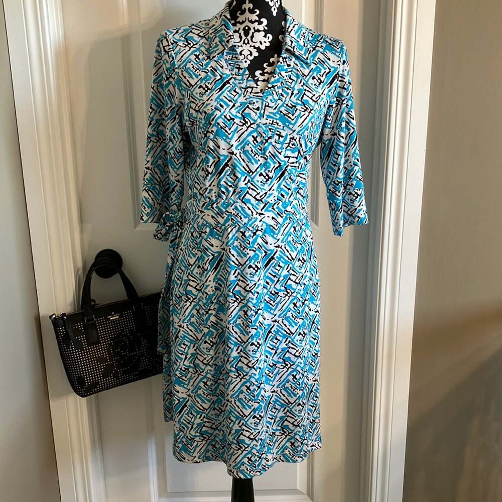 Blue and black print on white wrap dress.